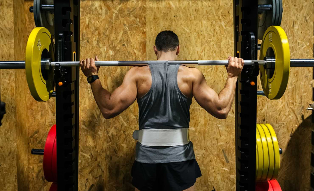 man with barbell on his back prepared to do a squat