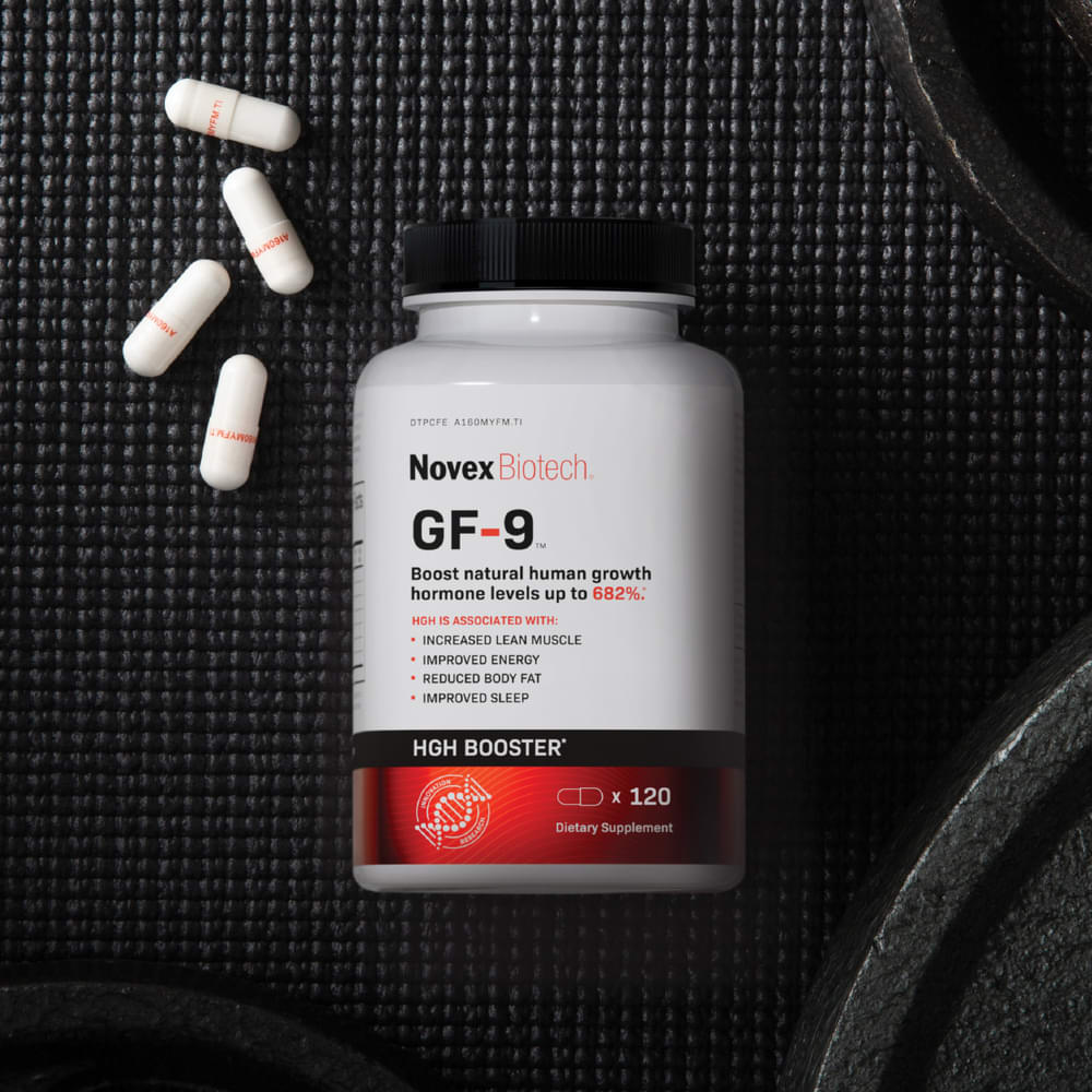 GF-9 bottle with capsules and weights on dark background.
