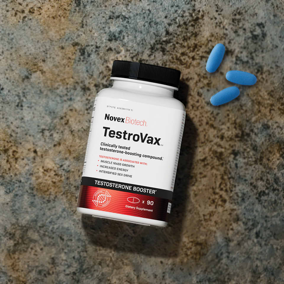 A bottle of Novex Biotech TestroVax, a dietary supplement labeled as a Testosterone Booster containing 90 capsules. The label indicates it is clinically tested to boost testosterone, associated with muscle mass growth, increased energy, and intensified sex drive. 